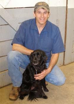 Veterinarian Alan B. Carlson with his dog.